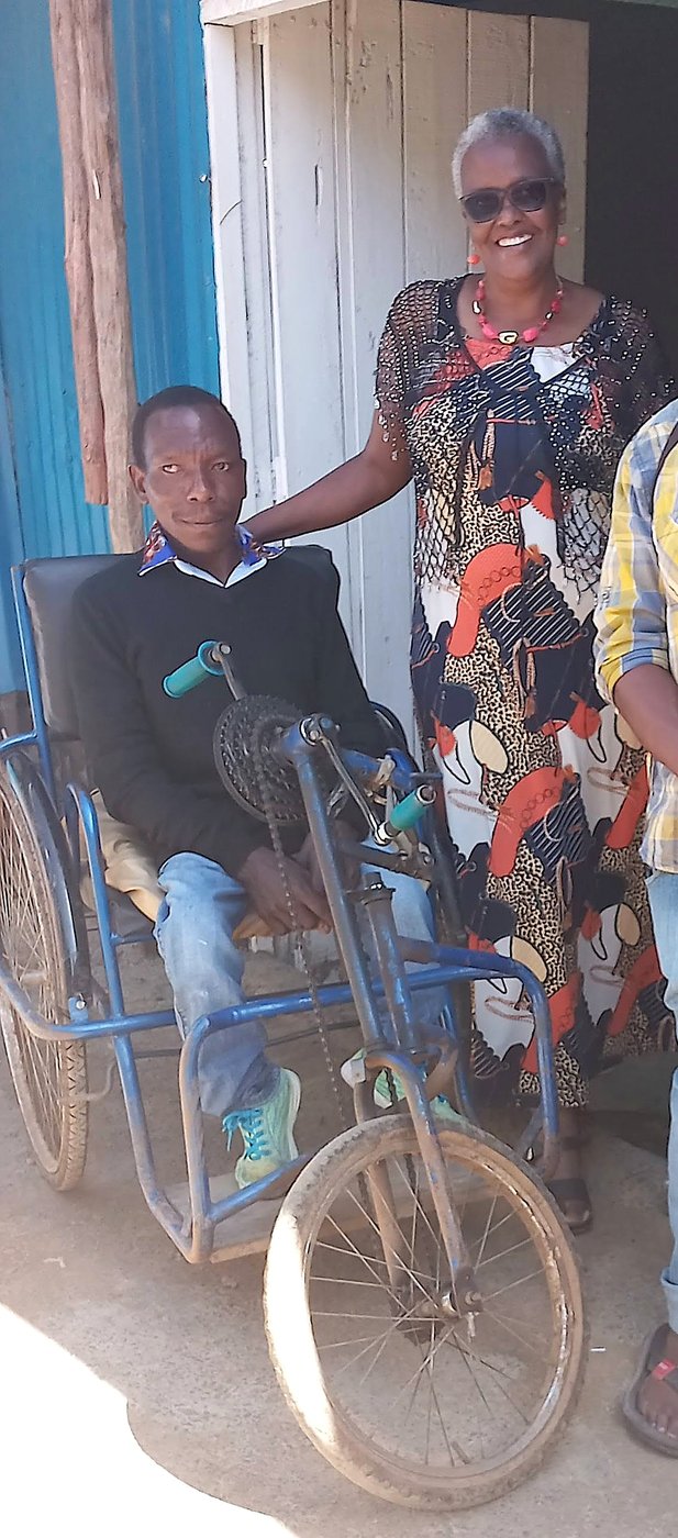 Support for an elderly community member with a mobility aid