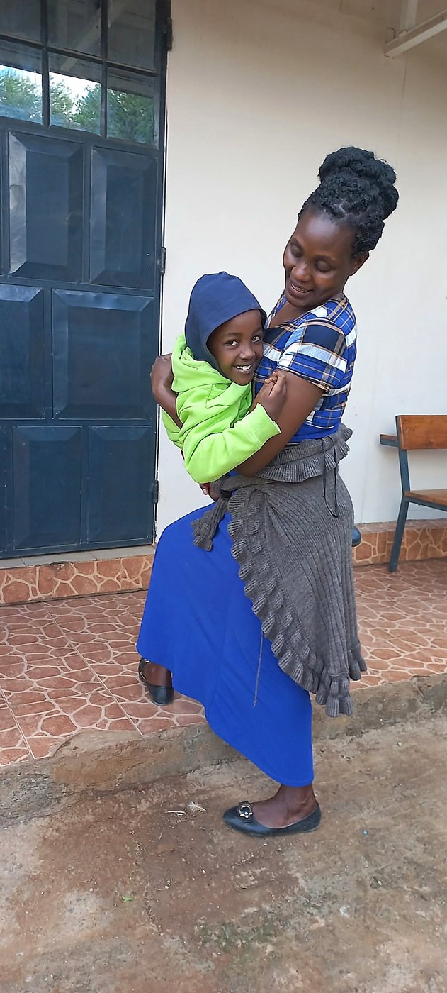 A mother carrying her child outside a GCIG venue